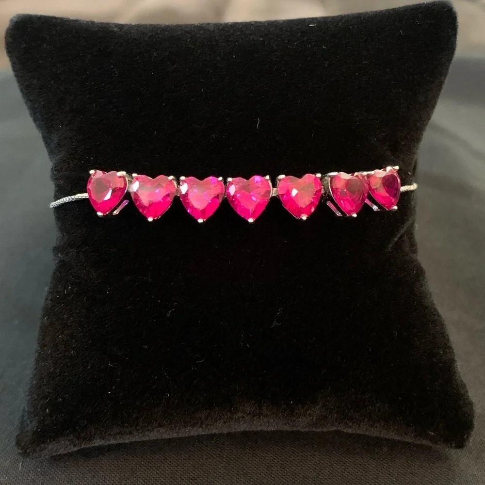 Rhodium over sterling silver lab ruby heart bolo bracelet
